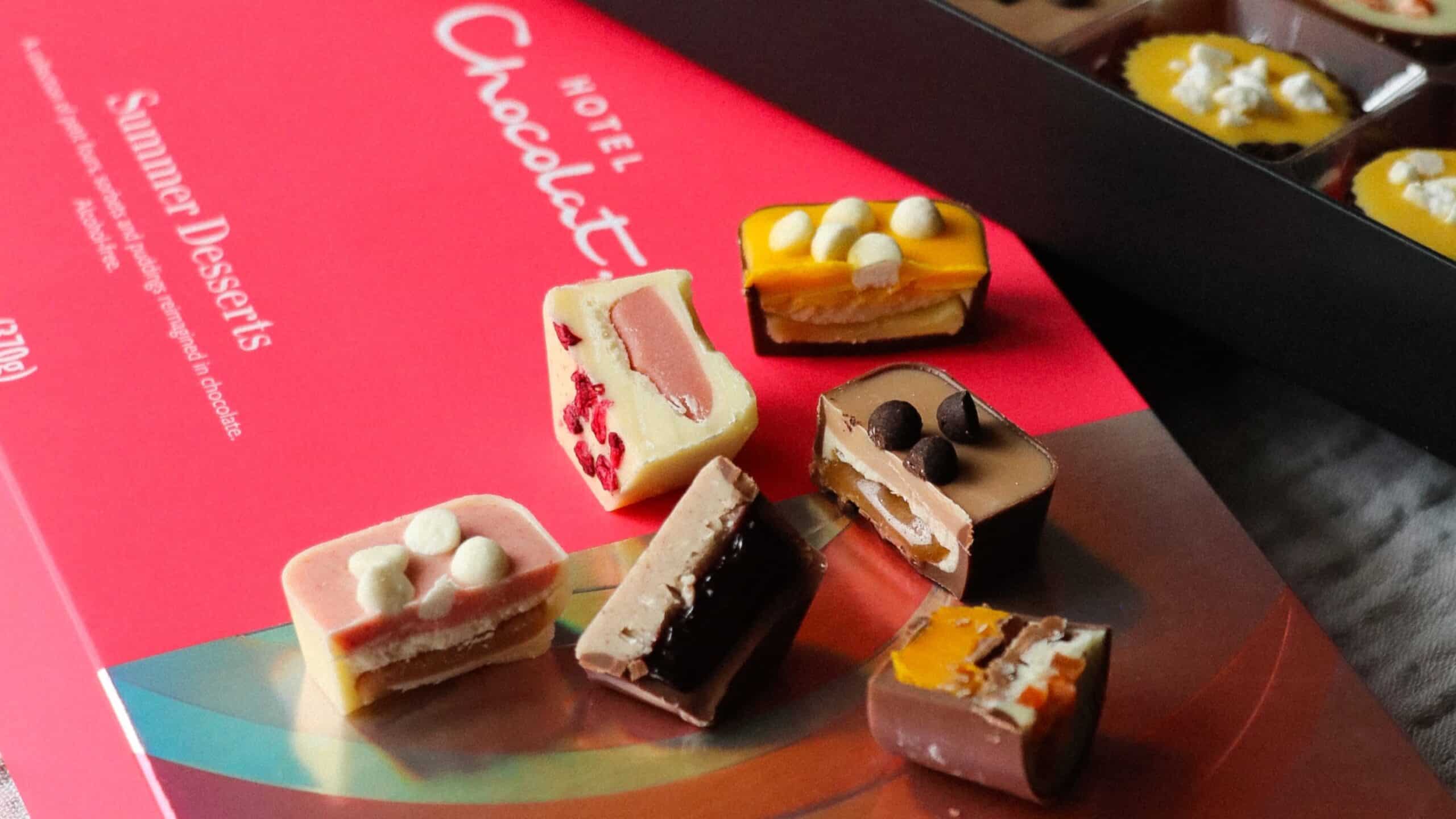 6 small chocolates lying on top of a hotel chocolat box.